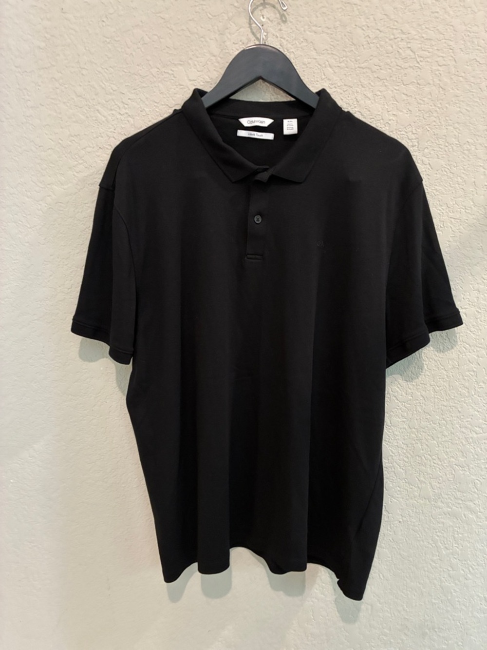Calvin Klein Men's Black Polo Shirt with Subtle Logo